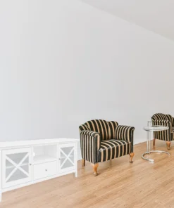 Hamptons-style TV unit with metal runners and black felt drawers, displayed in a sophisticated lounge.