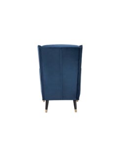 Stylish armchair with springs and soft-touch fabric, enhancing a cozy living space.