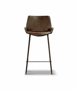 Versatile bar chair with PU leather and metal legs, displayed in a stylish dining area.