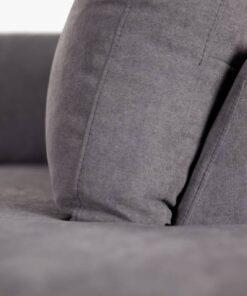 Versatile dark grey fabric lounge with corner chaise, durable ply frame, and plush foam cushions for ultimate comfort.