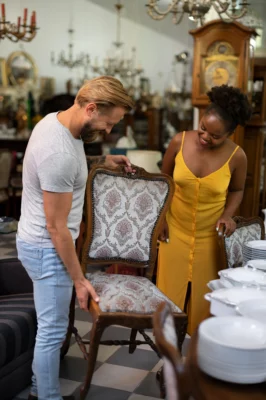 Salesman Showing Furniture to Customers at the Best Furniture Stores in Sydney | Half Price Furniture