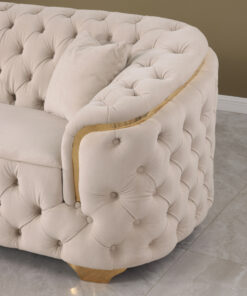 Plush velvet lounge with polyester filling and S springs, displayed in a modern lounge space.