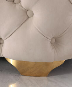 Beige velvet lounge with S spring support and plush filling, set in a cozy lounge.