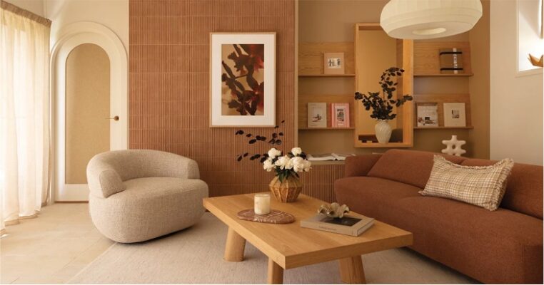stylish lounge room with earthy brown and cream colour combination, featuring textured sofa and accent chair